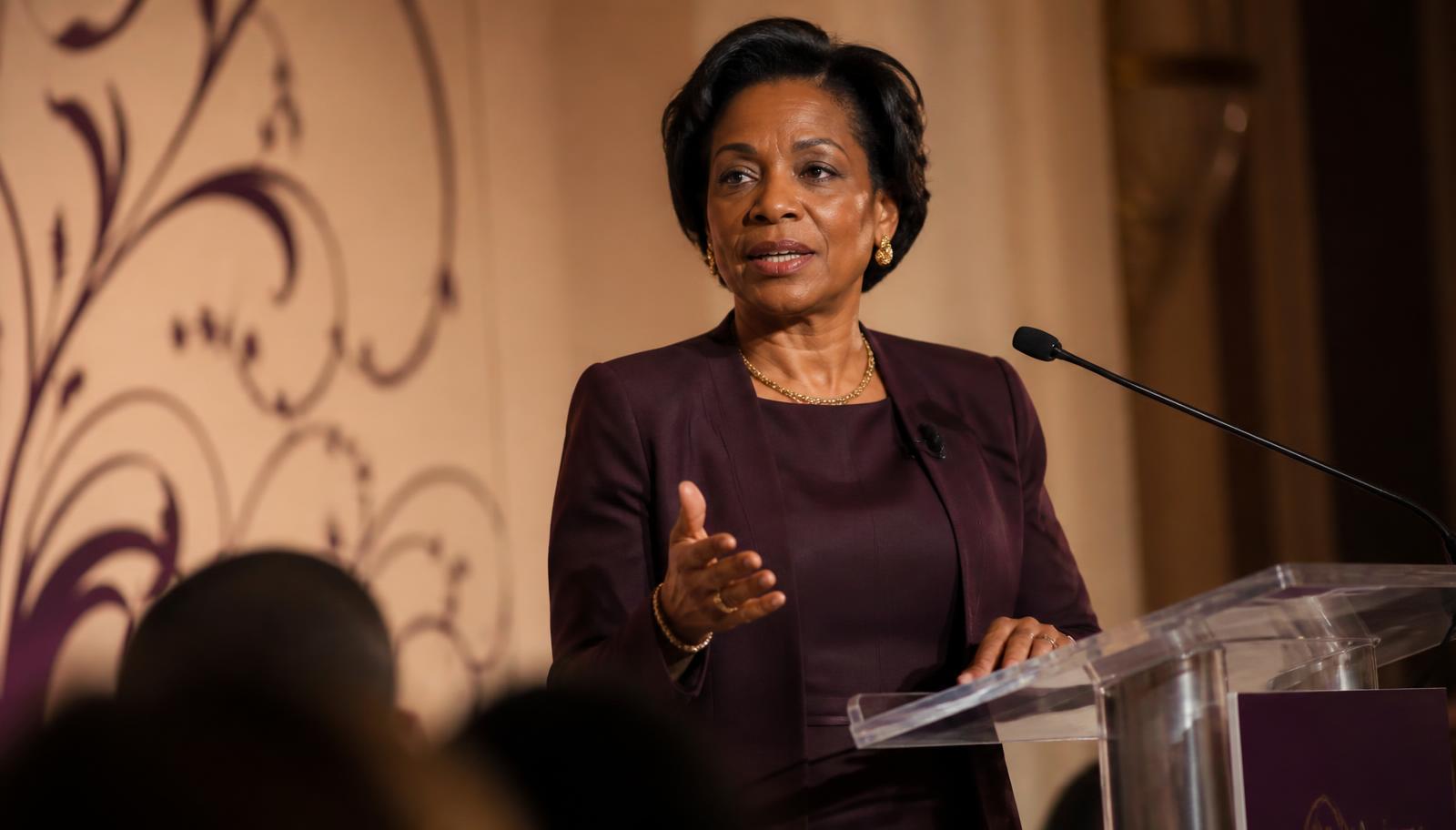 A Black woman leader delivering a keynote address to a conference audience